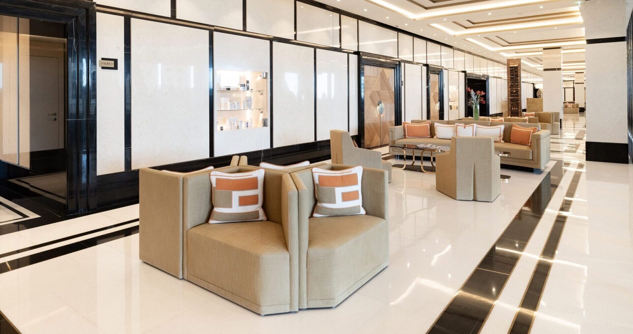 Bay House Monaco luxury residential lobby with lounge seating and marble interior