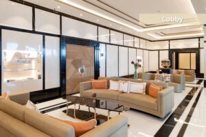 Bay House Monaco luxury residential lobby with lounge seating and marble interior