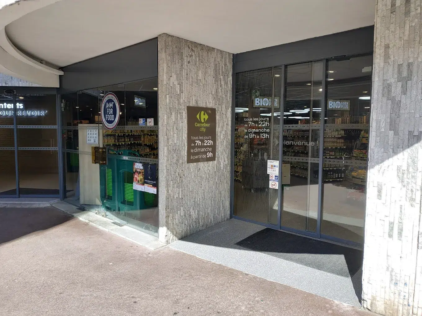 Supermarket entrance at the bottom of the Millefiori building