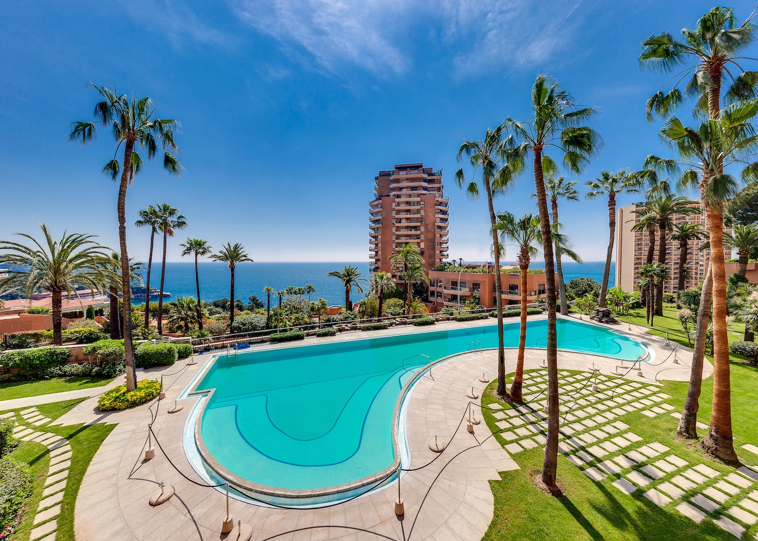 Swimming pool and landscaped gardens at Parc Saint Roman residence in Monaco