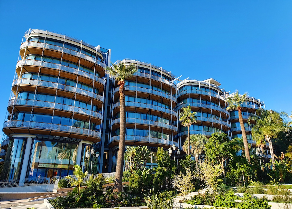 One Monte Carlo building pictured from the casino gardens, surrounded by greenery