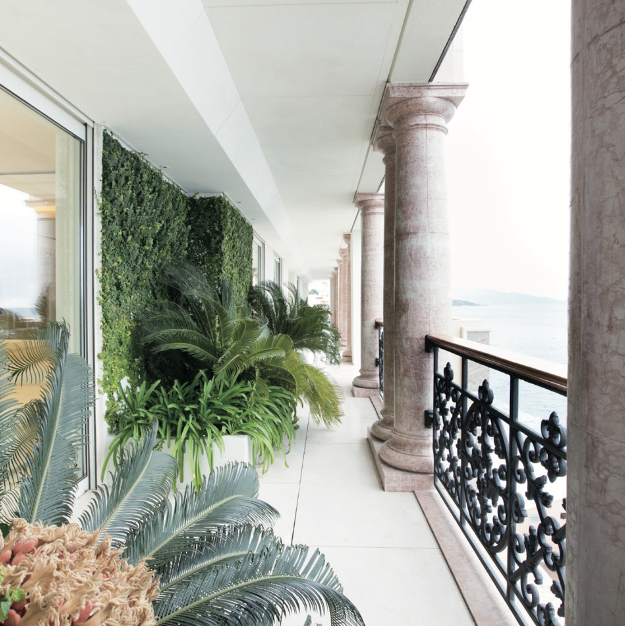 Palazzo Leonardo Monaco private terrace with marble columns, greenery and sea views